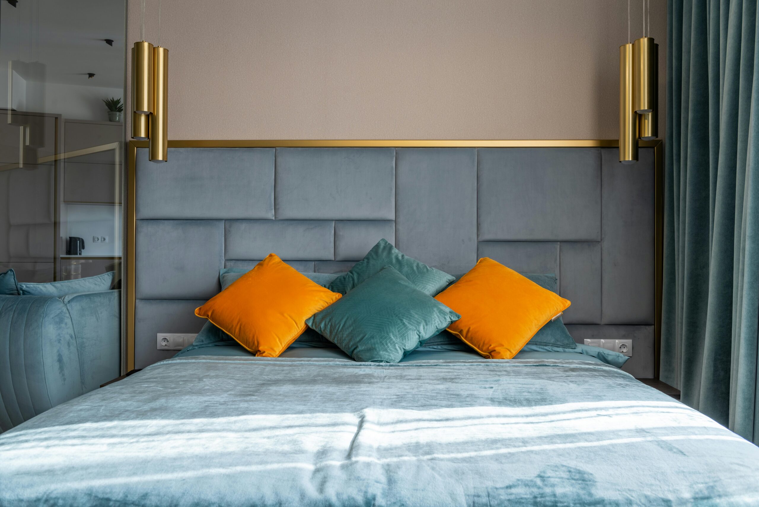 A colorful handwoven tapestry hanging on a bedroom wall