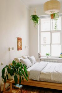 A colorful handwoven tapestry hanging on a bedroom wall.
