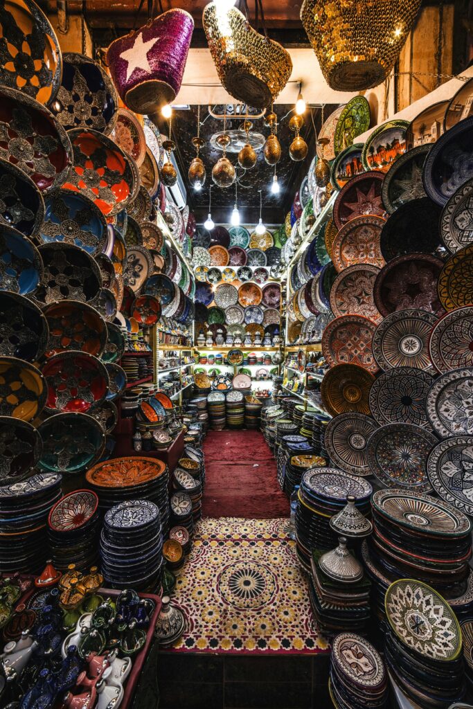 A photo showcasing a variety of beautiful Indian handicrafts, like a woven rug, a metal lamp, and a colorful painting.