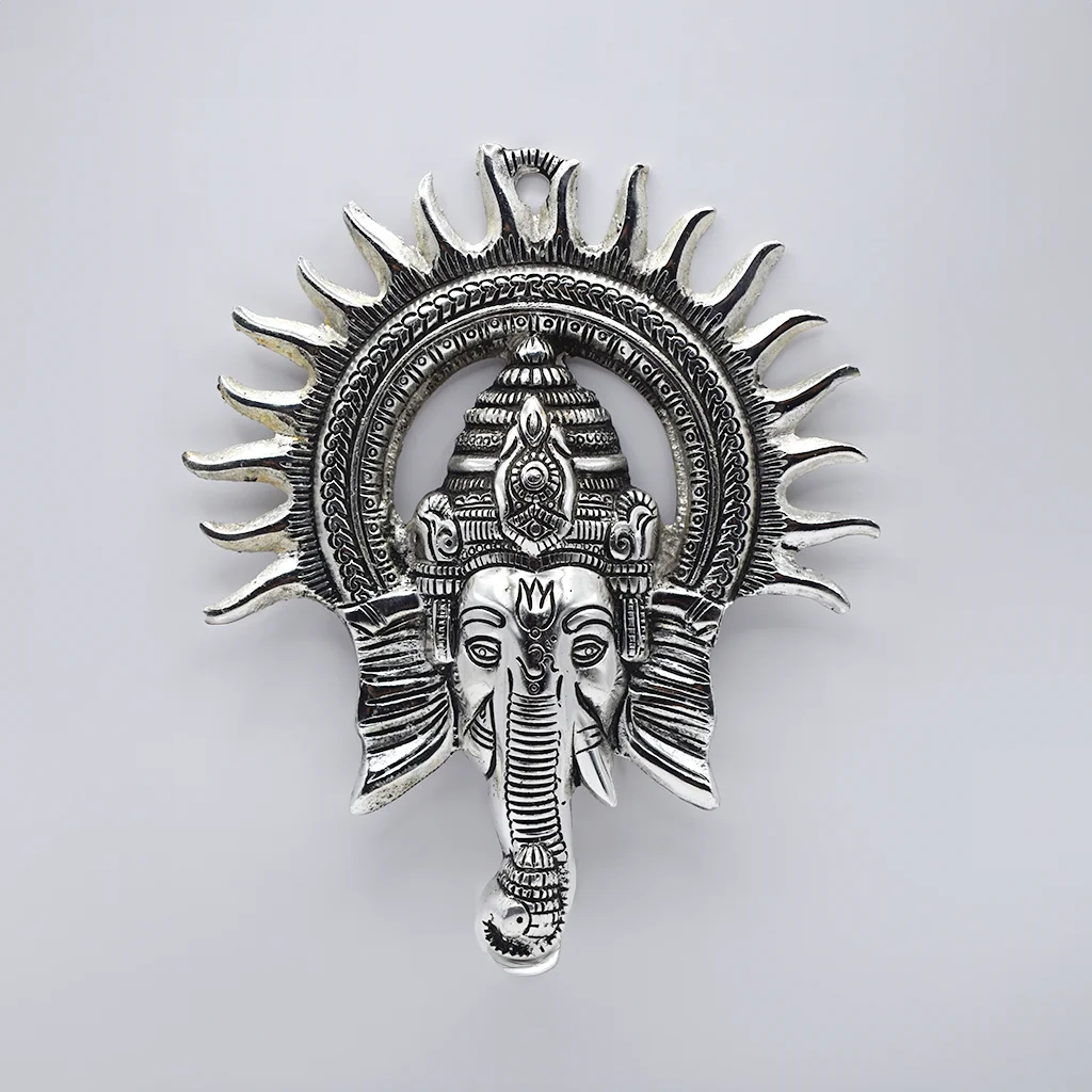 Home decor Silver Radiance Ganesha”—a wall hanging that is as beautiful as it is spiritually uplifting. Made with meticulous craftsmanship, this piece is perfect for those looking to infuse their spaces with divine energy while adding a touch of sophistication.