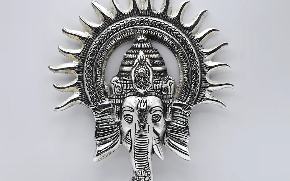 Home decor Silver Radiance Ganesha”—a wall hanging that is as beautiful as it is spiritually uplifting. Made with meticulous craftsmanship, this piece is perfect for those looking to infuse their spaces with divine energy while adding a touch of sophistication.